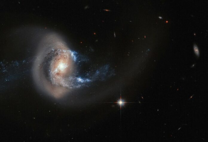 a spiral shaped object in the middle of a dark sky